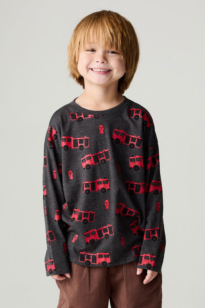 Front view of a boy wearing the Chaser Fire Trucks Boys Tee on a neutral background with arms lowered at sides