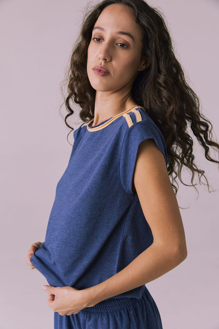 Side studio shot of the Chaser Flora Cropped Honest Indigo Cap Sleeve Crewneck Tee paired with Taylorr Shorts featuring natural drape and easy fit