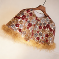 Handcrafted floral sequin bridal capelet featuring shimmering embroidery with soft faux fur trim in gold and burgundy.