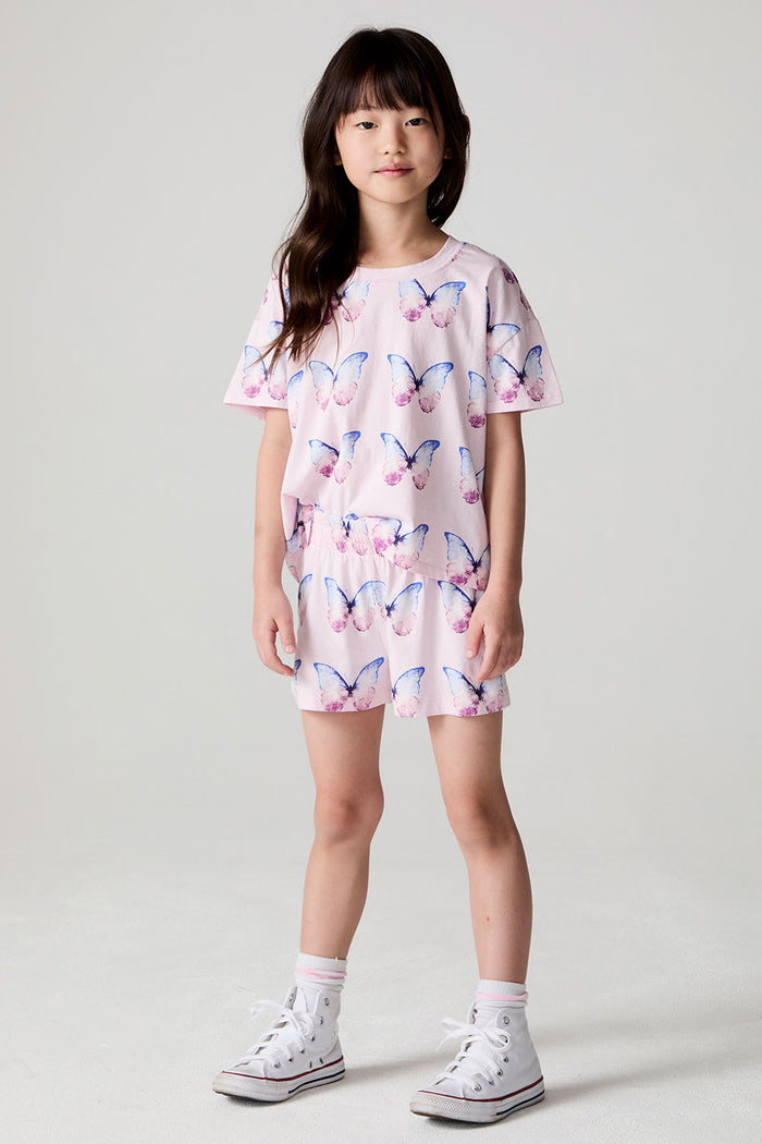Front view of a girl wearing the Chaser  Flutter Butterfly Shorts and shirt on a neutral background