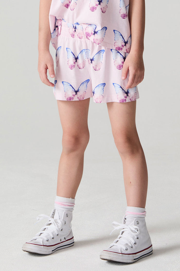 Front view of a girl wearing the Chaser  Flutter Butterfly Shorts and matching butterfly shirt on a neutral background