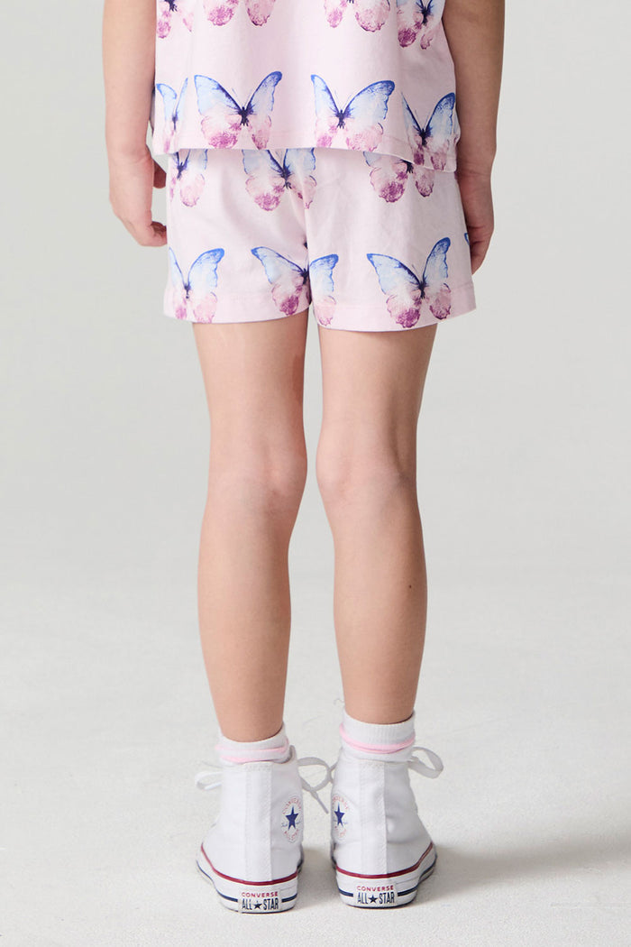 Back view of a girl wearing the Chaser  Flutter Butterfly Shorts on a neutral background