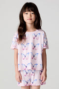 Front view of a girl wearing the Chaser Flutter Butterfly Tee on a neutral background