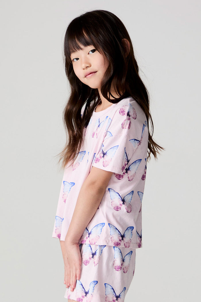 Side view of a girl wearing the Chaser Flutter Butterfly Tee on a neutral background