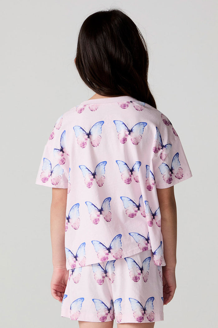 Back view of a girl wearing the Chaser Flutter Butterfly Tee on a neutral background