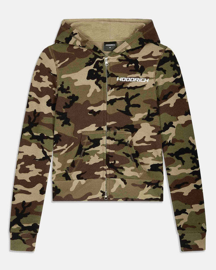 A cropped zip-up hoodie in a woodland camouflage pattern, featuring a white 'HOODRICH' logo printed on the left chest, displayed against a light gray background.