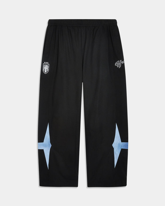 Black athletic sweatpants with white printed graphics on the upper thighs and light blue starburst shapes on the lower legs, shown flat against a light gray background.