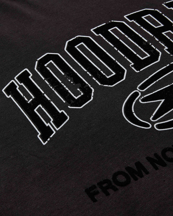 Black t-shirt with white text and logo on a dark background