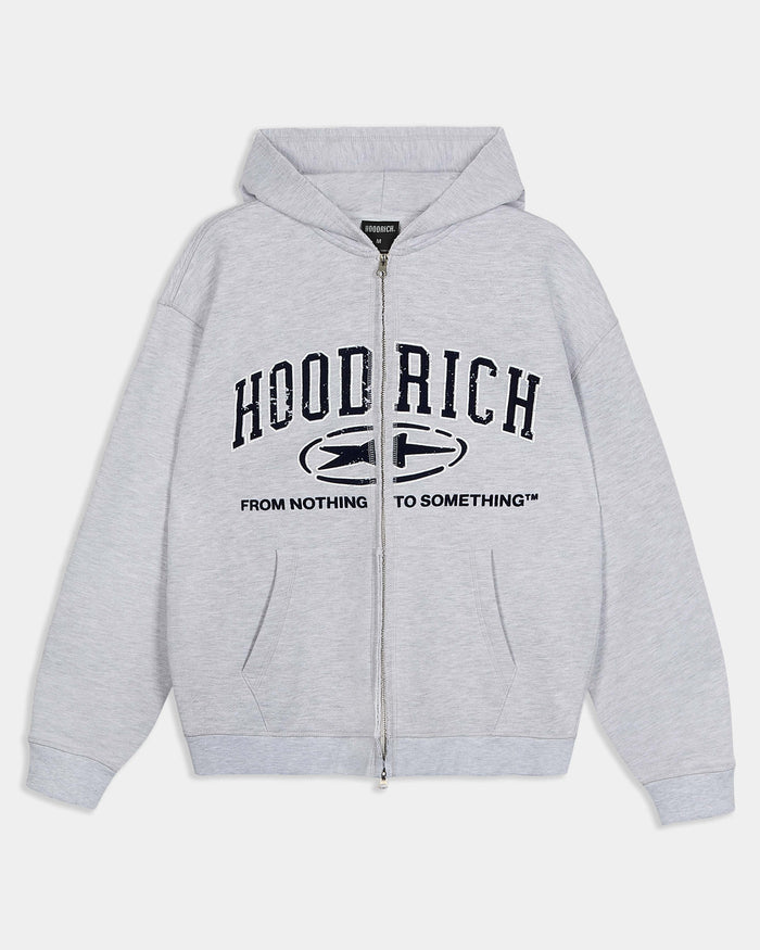 Relaxed grey marl zip-up hoodie featuring dark blue varsity-style Hoodrich branding and the slogan 'From Nothing To Something'