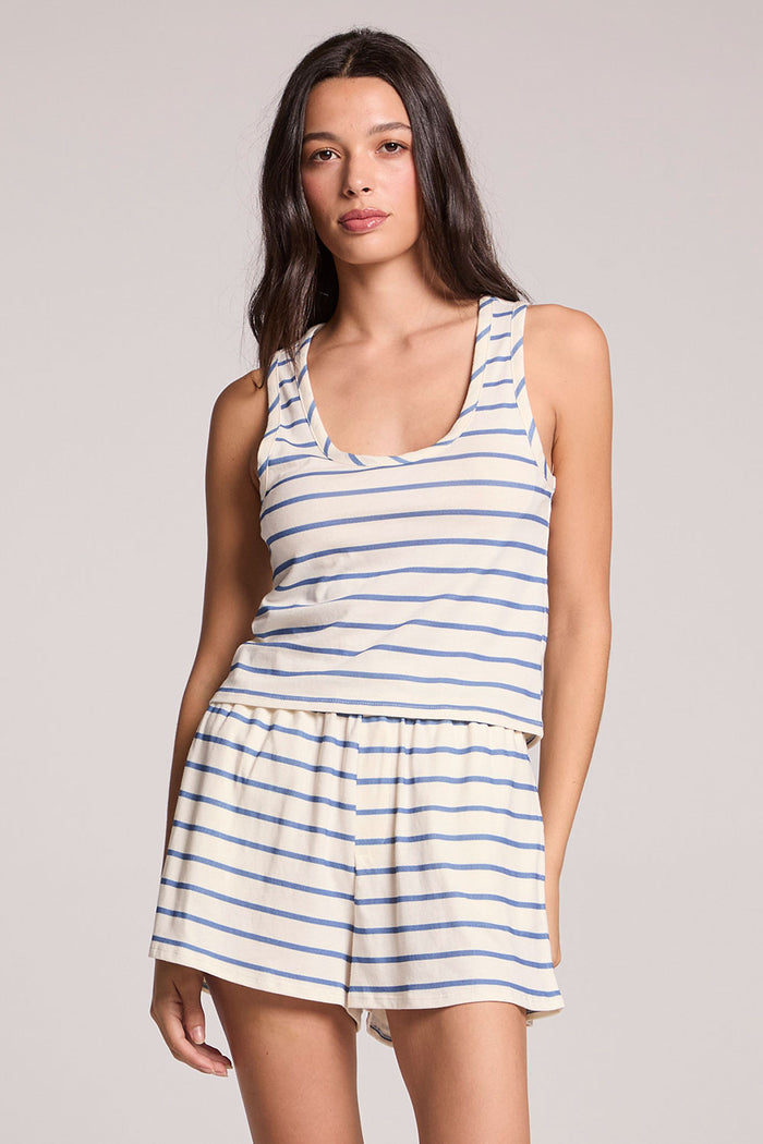 Front view of a woman dressed in the Chaser French Riviera Striped Siren tank on a neutral background