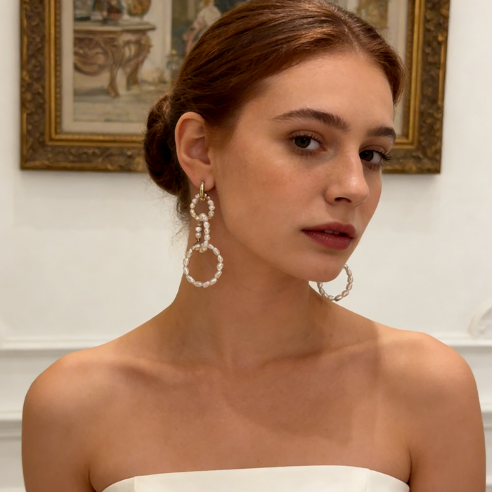 Handcrafted natural pearl wedding earrings worn by bride with timeless luxury bridal jewelry style