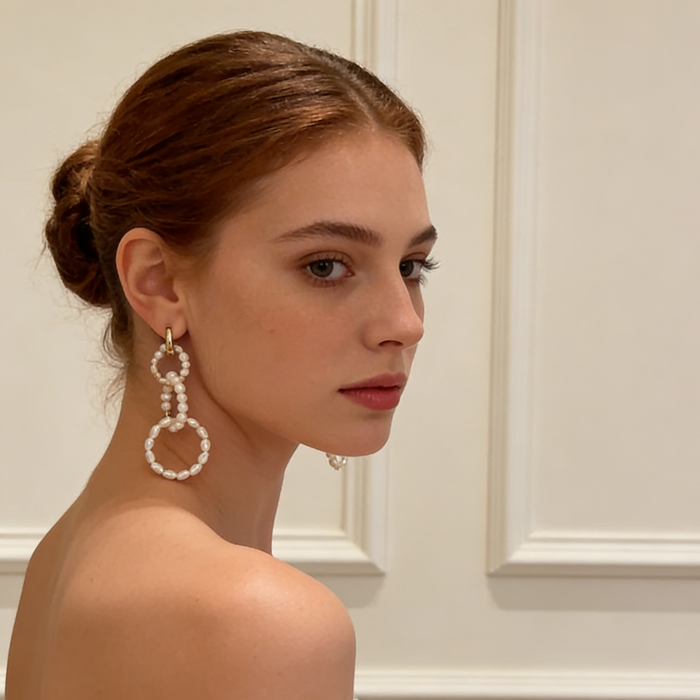 Handcrafted natural pearl wedding earrings worn by bride with timeless luxury bridal jewelry style