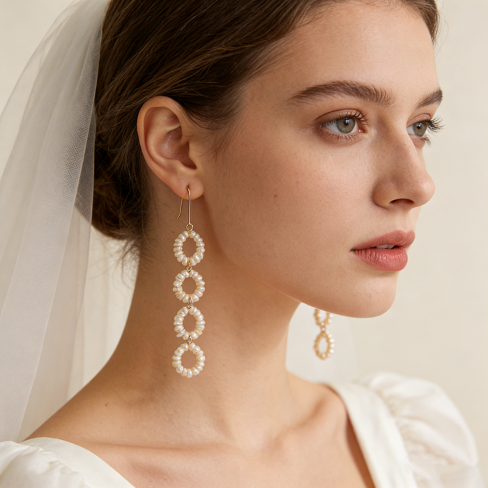 Modern bridal dangle earrings featuring genuine freshwater pearls arranged in elegant open-circle links.