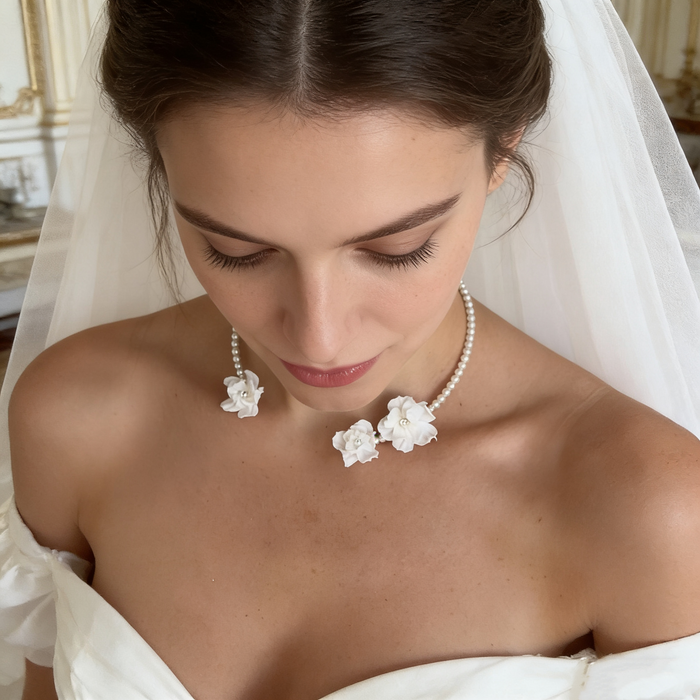 Handmade freshwater pearl bridal choker featuring delicate white resin flowers for an elegant wedding look.