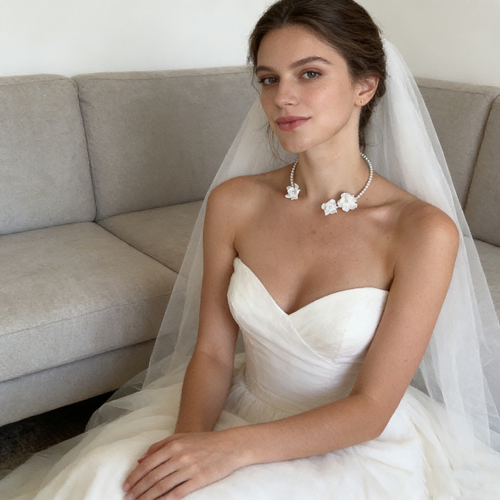 Handmade freshwater pearl bridal choker featuring delicate white resin flowers for an elegant wedding look.