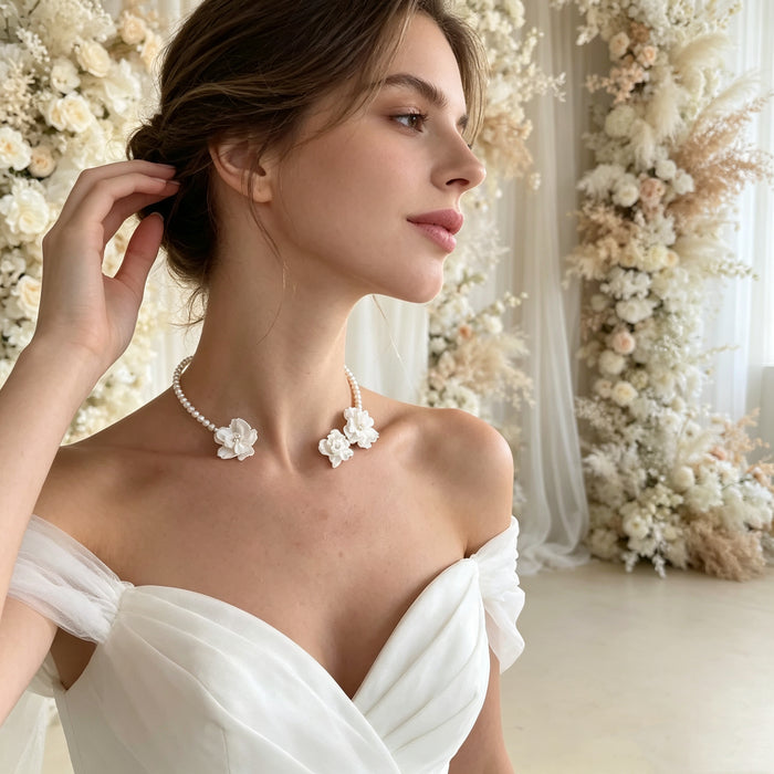 Romantic floral pearl bridal necklace handcrafted with freshwater pearls and resin flowers for modern brides.