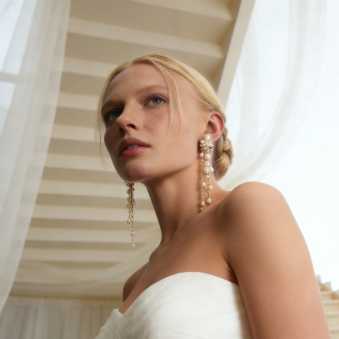 Luxury freshwater pearl tassel earrings featuring floral pearl clusters and delicate chain drops for bridal and formal occasions.