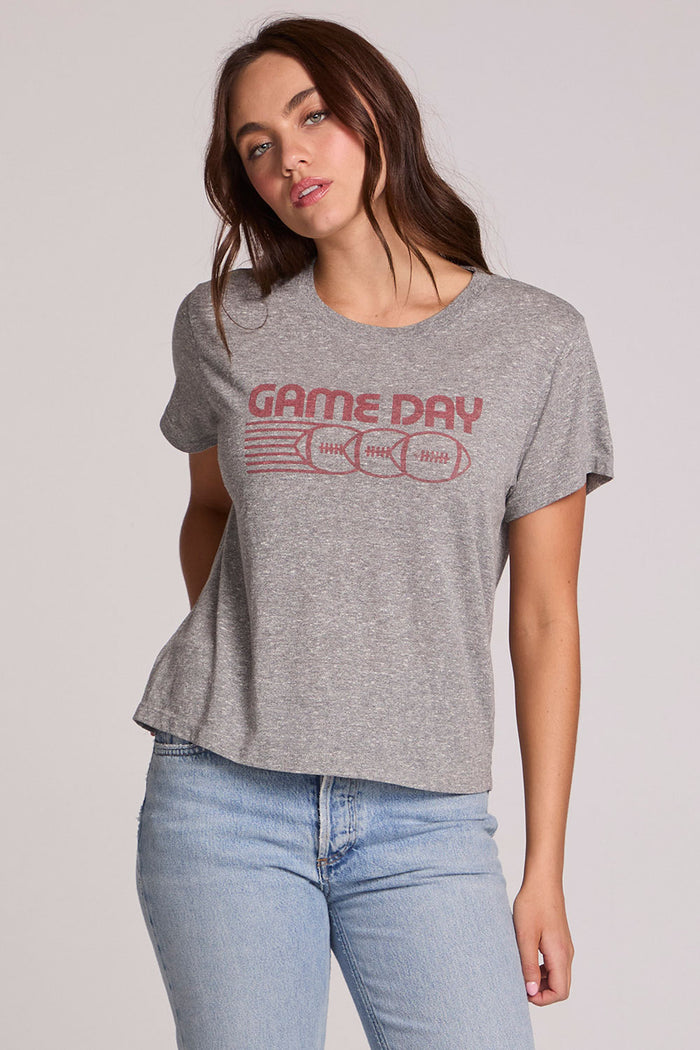Front view of a woman wearing the Chaser Game Days Graphic Tee on a neutral background