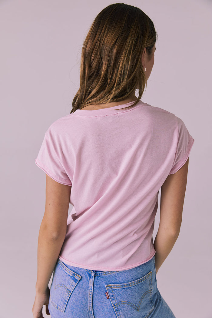 Back studio image of the Chaser Gator V Neck Nose Pink Tee paired with light-wash denim showing smooth finish and relaxed shape