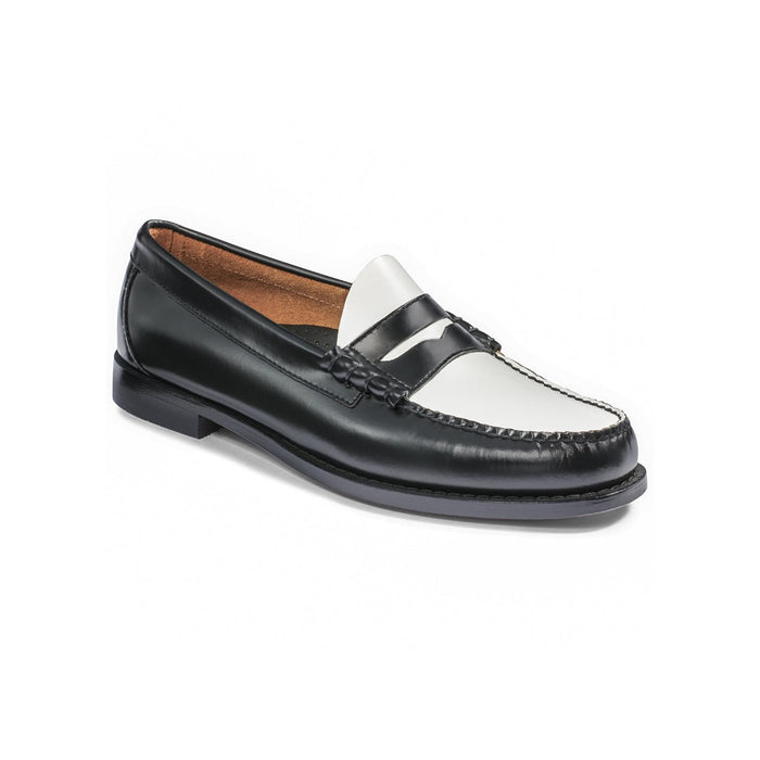 Black and white leather penny loafer, three-quarter angle view.