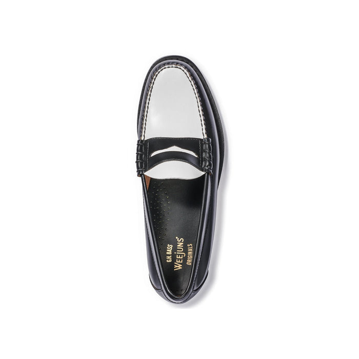 Black and white leather penny loafer, top-down view at a slight angle.