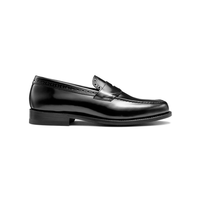 Black leather loafer with perforated brogue trim, side profile view.