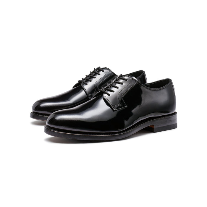 Black patent leather lace-up derby shoes, three-quarter angle pair view.