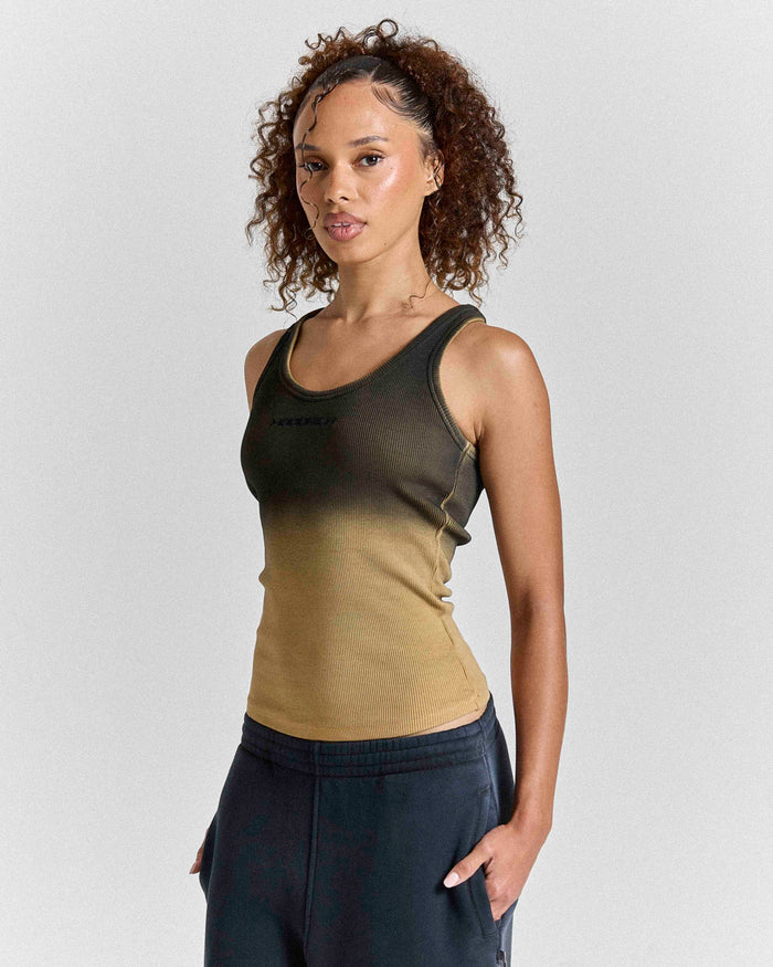 Model wearing a mustard and brown ombre fitted racer vest with a small Hoodrich logo on the chest.