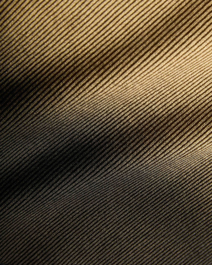Textured fabric with a diagonal pattern in brown and black.