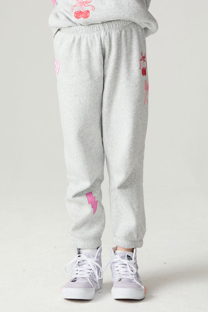 Front view of a girl wearing the Chaser Girl Power Medley Pants Girls Jogger on a neutral background with matching top