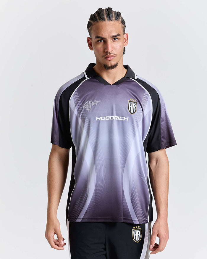 Person wearing a purple and black sports jersey with 'Hoodrich' branding on a white background