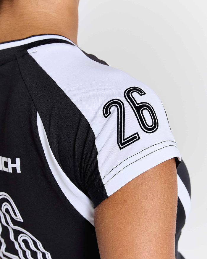 Black and white sports jersey with number 26 on a plain background