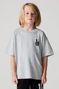 Front view of a boy wearing the Chaser Go Team Tee  on a neutral background