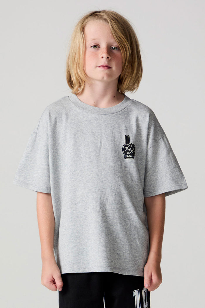 Front view of a boy wearing the Chaser Go Team Tee  on a neutral background