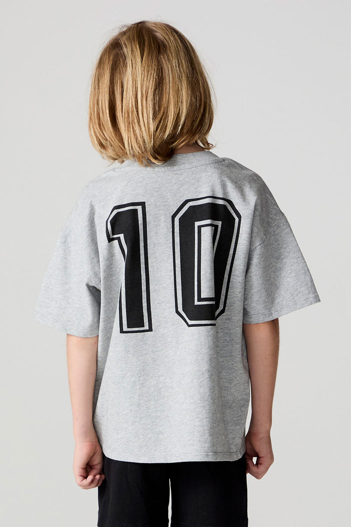 Back view of a boy wearing the Chaser Go Team Tee  on a neutral background
