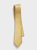 Gold silk necktie with a twill texture, draped on a white background