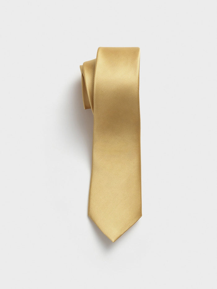 A folded gold tie with a textured pattern on a white background.