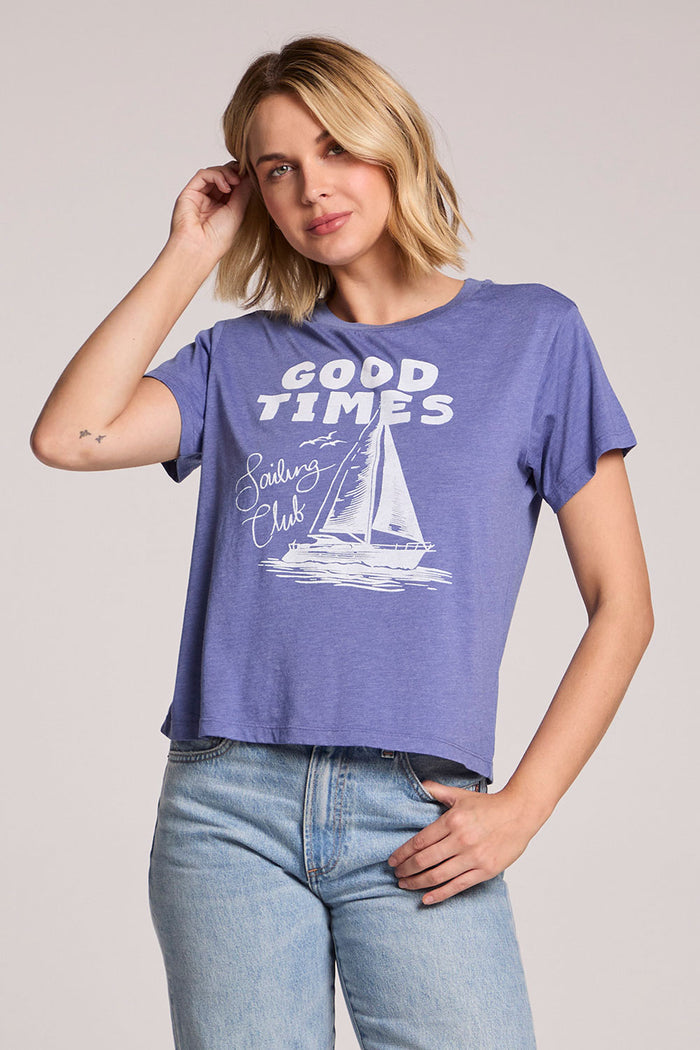 Front view of a woman wearing the Chaser Good Times Sailing Club Tee and jeans on a neutral background