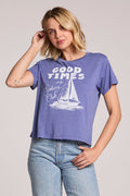 Front view of a woman wearing the Chaser Good Times Sailing Club Tee and jeans on a neutral background