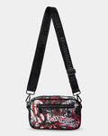 Crossbody bag with black strap and colorful pattern on a white background