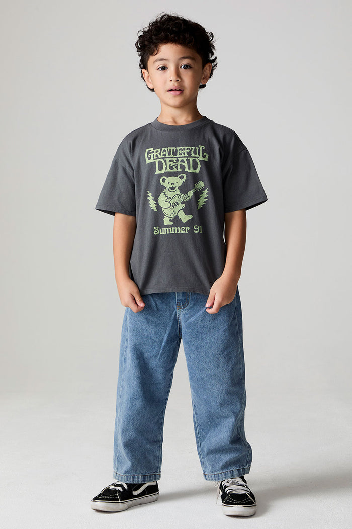 Full body front view of a boy wearing the Chaser Grateful Dead Tour Tee on a neutral background