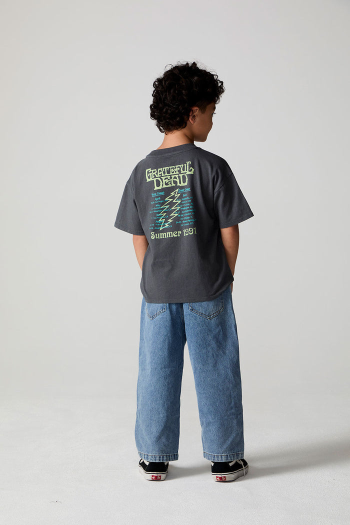 Full body back view of a boy wearing the Chaser Grateful Dead Tour Tee on a neutral background