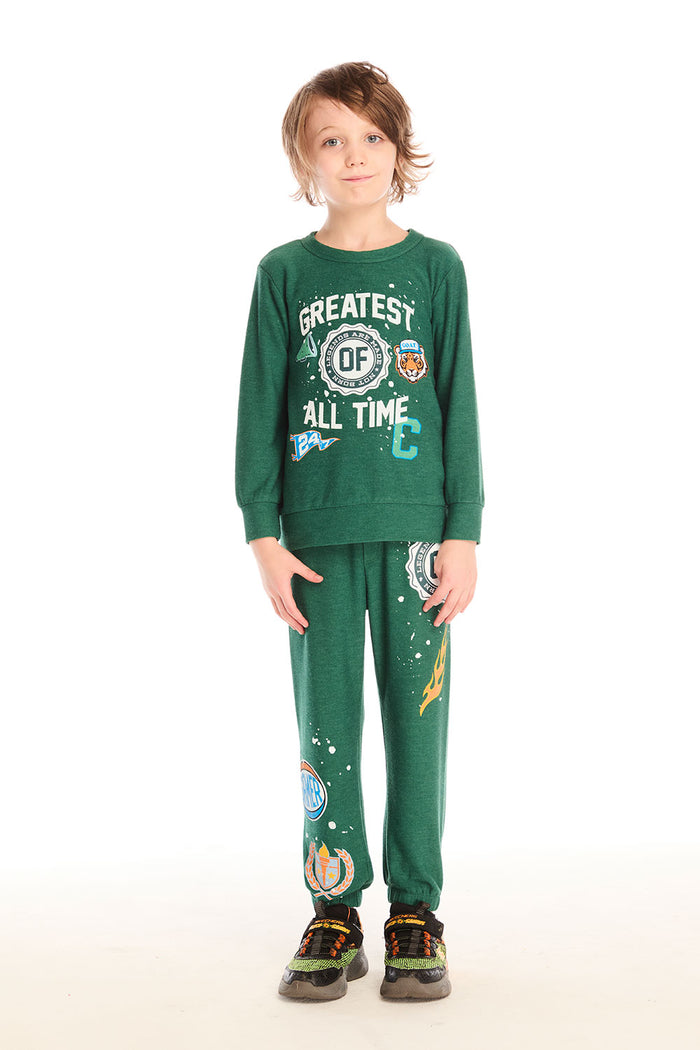 Full body view of boy wearing Chaser’s Greatest Of All Time Everest Green long sleeve top with matching joggers on a white background