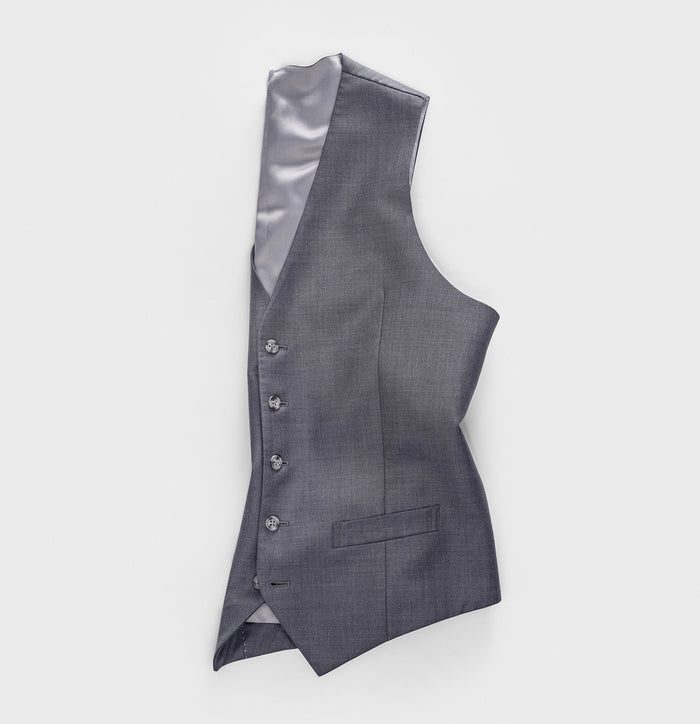 Grey suit vest laid at an angle, front buttons and welt pocket visible, lining exposed