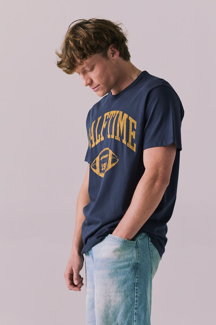 Side view of retro Halftime 1984 tee in navy.