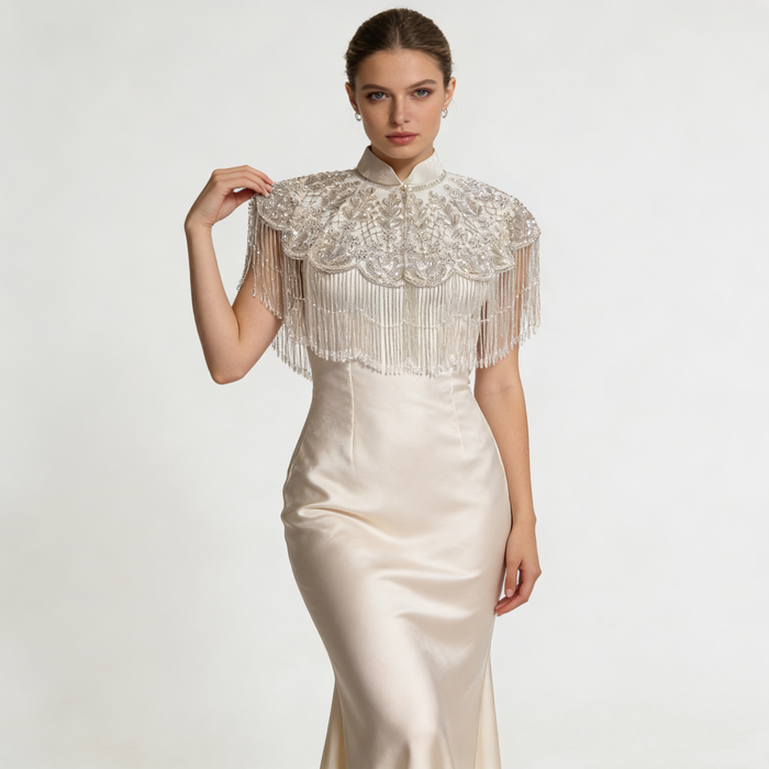 Luxury handmade beaded bridal cape with sequin embroidery and flowing fringe details for wedding dress styling.