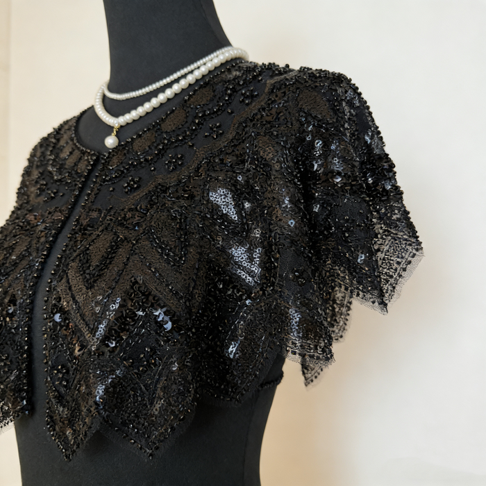 Luxury black gothic wedding shoulder cape with handcrafted bead embroidery and shimmering sequins for formal bridal styling.