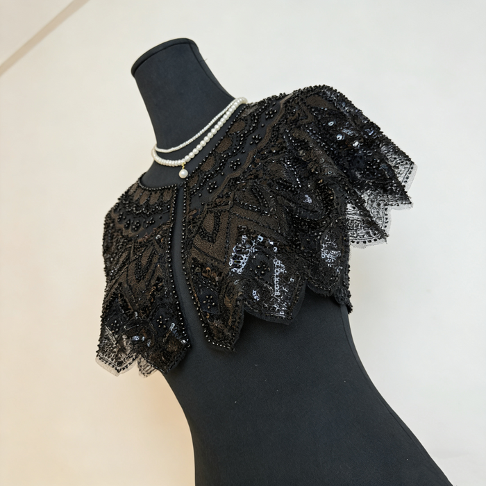 Luxury black gothic wedding shoulder cape with handcrafted bead embroidery and shimmering sequins for formal bridal styling.
