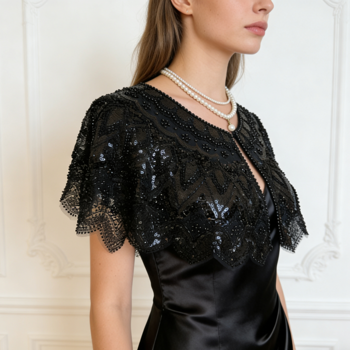 Handmade black bridal capelet featuring intricate sequin bead embroidery, embroidered lace, and elegant scalloped edges.