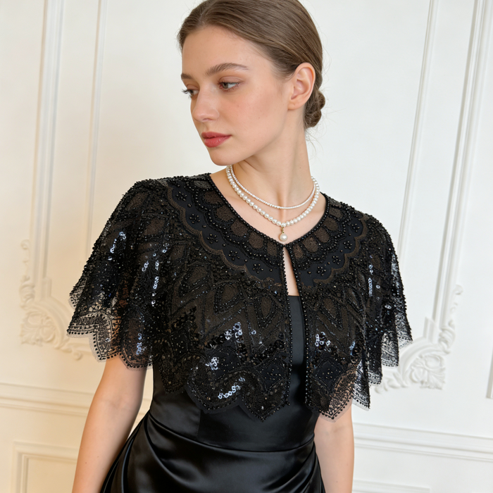 Handmade black bridal capelet featuring intricate sequin bead embroidery, embroidered lace, and elegant scalloped edges.